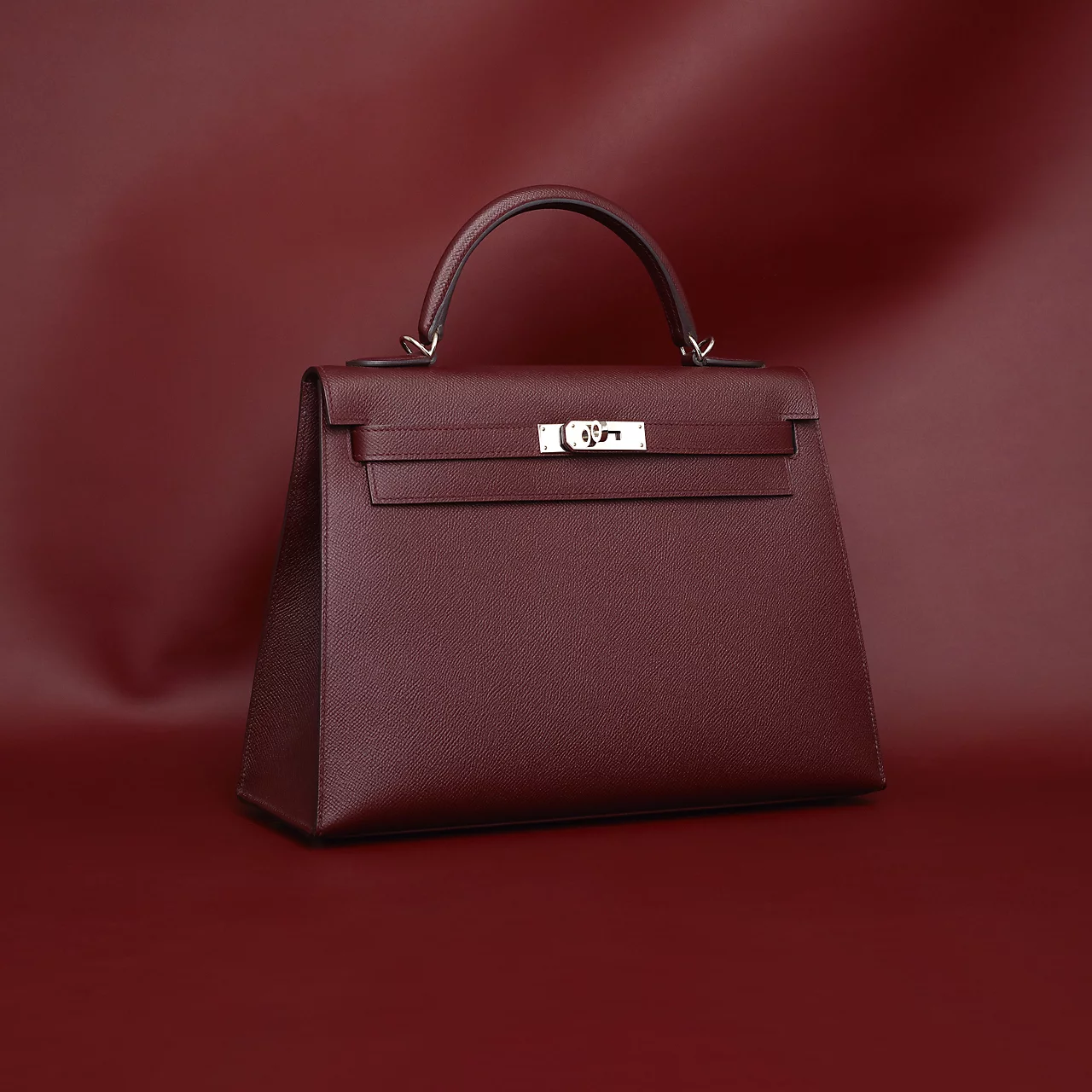 Kelly: Born From A Pregnancy PhotographLong before it was named after her, the Kelly bag already existed, designed with straps by Robert Dumas in the 1930s. Its transformation into legend came courtesy of Grace Kelly, photographed holding the bag over her stomach to shield her pregnancy from paparazzi lenses. That single image rewrote the bag's fate. The Kelly now comes in everything from mini to size 40, and in India, a standard Kelly in leathers like Togo or Epsom generally starts around ₹10-11 lakh, with exotic skins pushing prices to even 50 Lakh. Kelly: Born From A Pregnancy PhotographLong before it was named after her, the Kelly bag already existed, designed with straps by Robert Dumas in the 1930s. Its transformation into legend came courtesy of Grace Kelly, photographed holding the bag over her stomach to shield her pregnancy from paparazzi lenses. That single image rewrote the bag's fate. The Kelly now comes in everything from mini to size 40, and in India, a standard Kelly in leathers like Togo or Epsom generally starts around ₹10-11 lakh, with exotic skins pushing prices to even 50 Lakh.