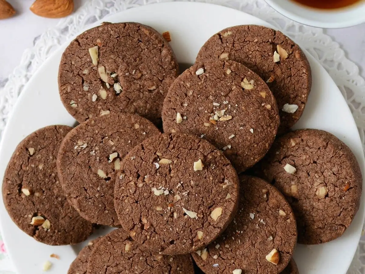 Ragi Cookies: Satisfy your sweet tooth guilt-free by baking homemade ragi cookies using whole wheat, ragi flour, jaggery, and unrefined oils. Rich in iron and fiber, these crunchy baked treats serve as a healthier alternative to store-bought refined flour biscuits.
